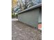 View of the side of the house with light green siding and dry lawn at 2983 Se 145Th Pl, Summerfield, FL 34491
