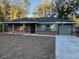 Beautiful single-story home featuring a covered front porch and an attached one car garage at 2983 Se 145Th Pl, Summerfield, FL 34491