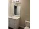 Bathroom features a modern vanity and a toilet at 2995 Se 145Th Pl, Summerfield, FL 34491