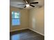 Bedroom features a ceiling fan and a window at 2995 Se 145Th Pl, Summerfield, FL 34491