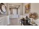 Inviting entryway featuring stylish decor, wainscoting, tiled flooring, and an elegant lighting fixture at 3063 Canopy Oak Blvd, Wildwood, FL 34785