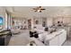 Spacious living area with modern decor, open floor plan, and seamless transition to the kitchen at 3063 Canopy Oak Blvd, Wildwood, FL 34785