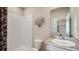 Bathroom featuring a shower, toilet, granite countertop vanity, and decorative mirror at 3067 Canopy Oak Blvd, Wildwood, FL 34785