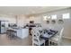 Open-concept kitchen and dining area with modern finishes and ample natural light at 3088 Canopy Oak Blvd, Wildwood, FL 34785