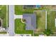 An aerial view of the property, highlighting its roof, landscaping, and surrounding neighborhood at 3203 Se 23 Ter, Ocala, FL 34471