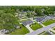 An aerial perspective showing the house nestled among mature trees in a peaceful neighborhood at 3203 Se 23 Ter, Ocala, FL 34471