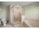 Spacious bathroom featuring tiled floors, shower, tub, and modern fixtures at 3203 Se 23 Ter, Ocala, FL 34471
