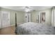 Bright bedroom with a ceiling fan, and a glass door to a private patio at 3203 Se 23 Ter, Ocala, FL 34471