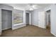 Bedroom featuring neutral walls, carpeted floors, closets, and ceiling fan at 3203 Se 23 Ter, Ocala, FL 34471