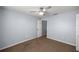 Bedroom with a ceiling fan and neutral walls, offering a calming space at 3203 Se 23 Ter, Ocala, FL 34471