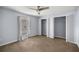 Bedroom with carpet, ceiling fan, and two closets with shelving at 3203 Se 23 Ter, Ocala, FL 34471