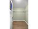 Walk-in closet featuring wood floors and wire rack shelving for optimal storage at 3203 Se 23 Ter, Ocala, FL 34471