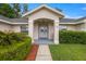 Inviting front entrance with manicured bushes and a walkway leading to the door at 3203 Se 23 Ter, Ocala, FL 34471