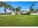 Charming single-story home with a well-manicured lawn, attached garage, and welcoming front entrance at 3203 Se 23 Ter, Ocala, FL 34471