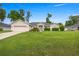 Charming single-story home with a well-manicured lawn and lush landscaping at 3203 Se 23 Ter, Ocala, FL 34471