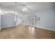 Open living room with vaulted ceiling and double doors leading outside at 3203 Se 23 Ter, Ocala, FL 34471