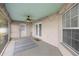 The covered patio extends the living space with a patterned rug and outdoor lighting at 3203 Se 23 Ter, Ocala, FL 34471