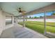 Screened-in patio offers seamless indoor-outdoor living with views of a spacious backyard at 3203 Se 23 Ter, Ocala, FL 34471