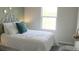 Cozy bedroom with a full bed, window, and stylish decor at 3282 Bertram Rd, Wildwood, FL 34785