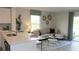 Cozy living area connected to the kitchen features stylish decor and ample natural light at 3282 Bertram Rd, Wildwood, FL 34785