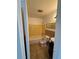 Bright bathroom featuring yellow-tiled walls, a white bathtub, and a dark vanity sink at 333 Marion Oaks Dr, Ocala, FL 34473