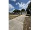A one-story home with a long driveway and attached garage on a sunny day at 333 Marion Oaks Dr, Ocala, FL 34473