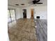 Living room area with tile floor and a sliding glass door leading to the porch at 333 Marion Oaks Dr, Ocala, FL 34473