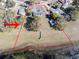 Aerial view of property with lake access and a private dock, outlined in red at 390 Sw Shorewood Dr, Dunnellon, FL 34431