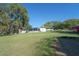 Spacious backyard with single-story home and mature trees at 390 Sw Shorewood Dr, Dunnellon, FL 34431