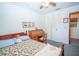 Clean bedroom with twin bed and roll top desk with plenty of light at 390 Sw Shorewood Dr, Dunnellon, FL 34431