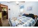 Well-lit bedroom featuring a bed, closet, and neutral walls at 390 Sw Shorewood Dr, Dunnellon, FL 34431