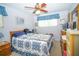 Relaxing bedroom with a bed, windows, and dresser at 390 Sw Shorewood Dr, Dunnellon, FL 34431