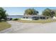 Charming single-story home with a two-car garage and a well-maintained lawn at 390 Sw Shorewood Dr, Dunnellon, FL 34431
