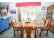 Bright living room with a dining table and view of the water at 390 Sw Shorewood Dr, Dunnellon, FL 34431
