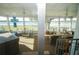 Spacious screened-in porch with scenic lake views and outdoor seating, perfect for relaxation and entertainment at 390 Sw Shorewood Dr, Dunnellon, FL 34431