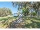 Garage and storage building on a spacious lawn at 390 Sw Shorewood Dr, Dunnellon, FL 34431