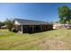 A view of the spacious backyard and a screened lanai, perfect for enjoying outdoor living at 4541 Sw 44Th Ln, Ocala, FL 34474