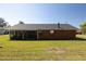 A view of the spacious backyard and a screened lanai, perfect for enjoying outdoor living at 4541 Sw 44Th Ln, Ocala, FL 34474