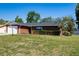 Brick home features a driveway and a well-maintained lawn at 4541 Sw 44Th Ln, Ocala, FL 34474