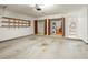 Spacious garage with shelving, storage area, and water heater at 4541 Sw 44Th Ln, Ocala, FL 34474