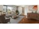 Bright living room features large window, hardwood floors, neutral tones, and modern decor at 4541 Sw 44Th Ln, Ocala, FL 34474