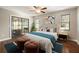 Bedroom featuring a glass sliding door leading to outside and a ceiling fan at 4541 Sw 44Th Ln, Ocala, FL 34474