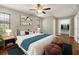 Bedroom featuring a ceiling fan, ensuite bathroom, and a walk-in closet at 4541 Sw 44Th Ln, Ocala, FL 34474