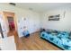 Bright bedroom boasts wood floors and is decorated with a fun, playful 'boyhood' theme at 5001 Sw 91St Pl, Ocala, FL 34476