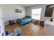 Cozy bedroom features wood flooring and is decorated with a fun, playful 'boyhood' theme at 5001 Sw 91St Pl, Ocala, FL 34476