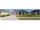Charming single-story home features a two-car garage and a well-maintained lawn, enhancing its curb appeal at 5001 Sw 91St Pl, Ocala, FL 34476