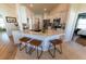 Bright kitchen featuring an island with bar seating, stainless steel appliances, and stone countertops at 5001 Sw 91St Pl, Ocala, FL 34476