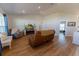 Bright and spacious living room with vaulted ceilings, plush seating, and modern flooring at 5001 Sw 91St Pl, Ocala, FL 34476