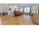 Open-concept living room with luxury vinyl plank flooring, modern furnishings, and natural light at 5001 Sw 91St Pl, Ocala, FL 34476