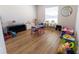 Playroom filled with toys and games and hardwood flooring at 5001 Sw 91St Pl, Ocala, FL 34476